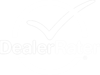 The DealerRater logo featuring the word "Dealer" in block typography and the word "Rater" in block typography. The words are surrounding by a light blue circle. A large check mark hovers above the words, intersecting the top of the circle. The logo is entirely the color white.